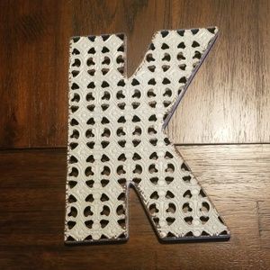 Light grey "K" decor